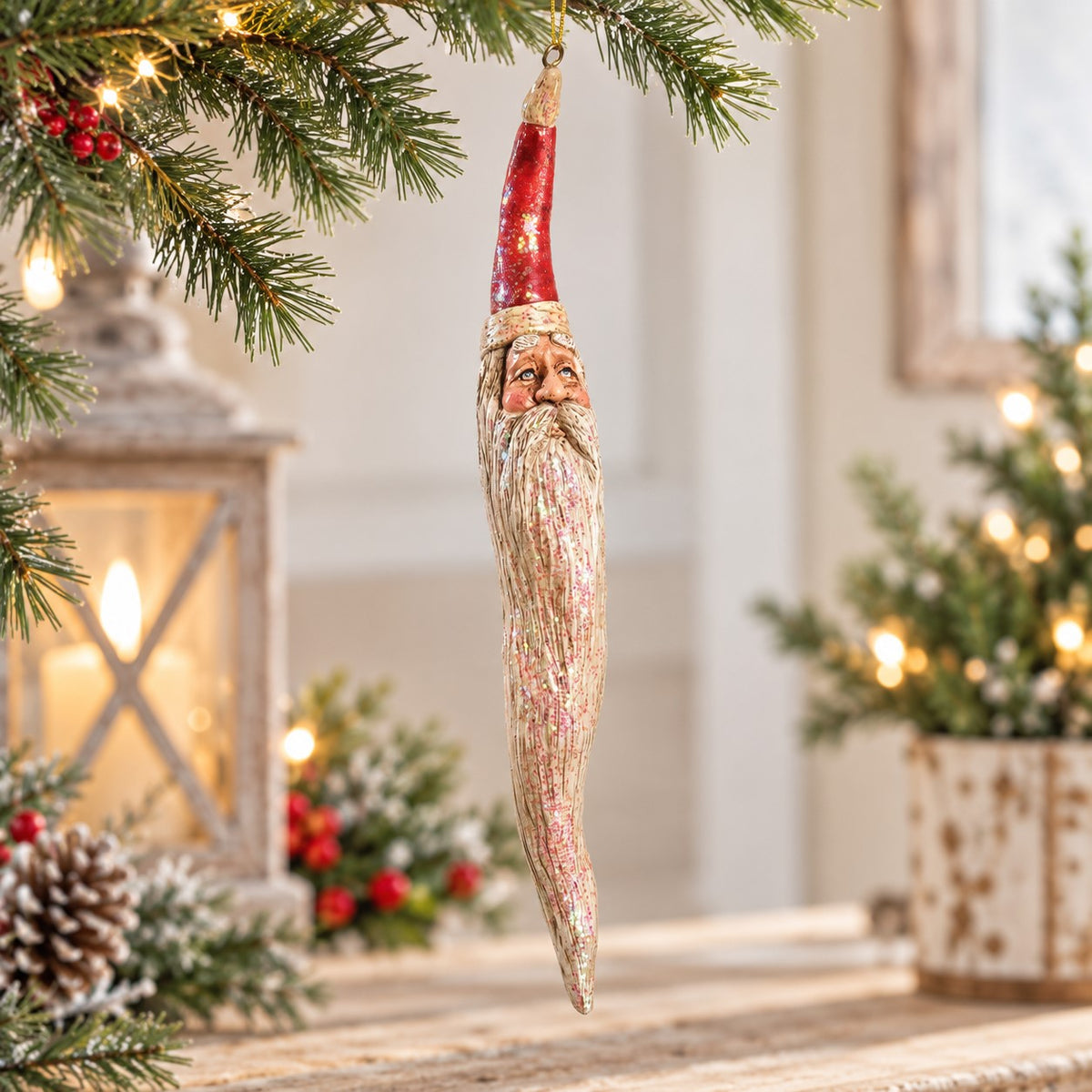 Bert Anderson tall twisted Santa ornament with glitter finish displayed in a light Christmas home décor setting with warm lights and greenery.