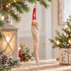 Bert Anderson tall twisted Santa ornament with glitter finish displayed in a light Christmas home décor setting with warm lights and greenery.