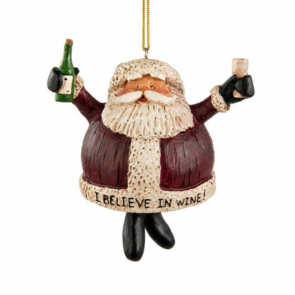 Bert Anderson “I Believe in Wine” Santa ornament holding a green wine bottle and wine glass with dangling black boots on a white background.