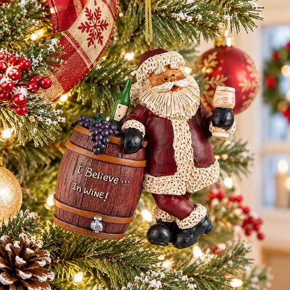 Bert Anderson Santa wine ornament with “I Believe in Wine” barrel hanging on a brightly decorated Christmas tree.
