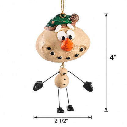 Snowman ornament with wire arms and legs and green hat, orange nose, and mittens and shoes, shown on a white background with dimension lines indicating 4 inches tall by 2 1/2 inches wide.