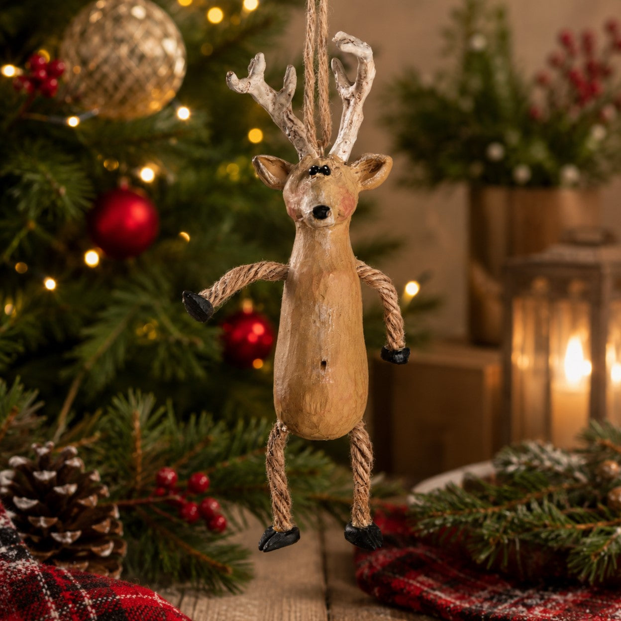 Deer Ornament hanging from a Christmas tree.