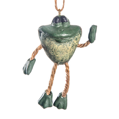 Hand-painted green frog ornament with big eyes, wide smile and dangly jute legs by Bert Anderson on a white background.