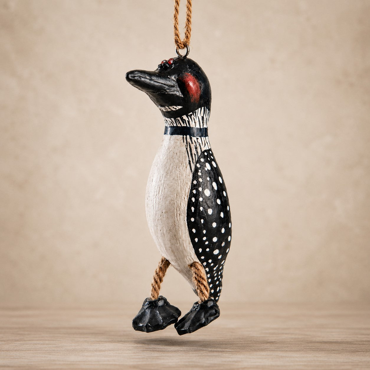 Hand-painted loon ornament white dots on black by Bert Anderson.
