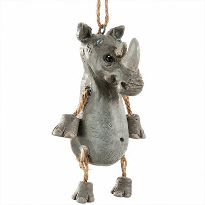 A gray rhinoceros hanging ornament with rope details and small blue bead accents on its eyes, shown against a plain white background.  by Bert Anderson