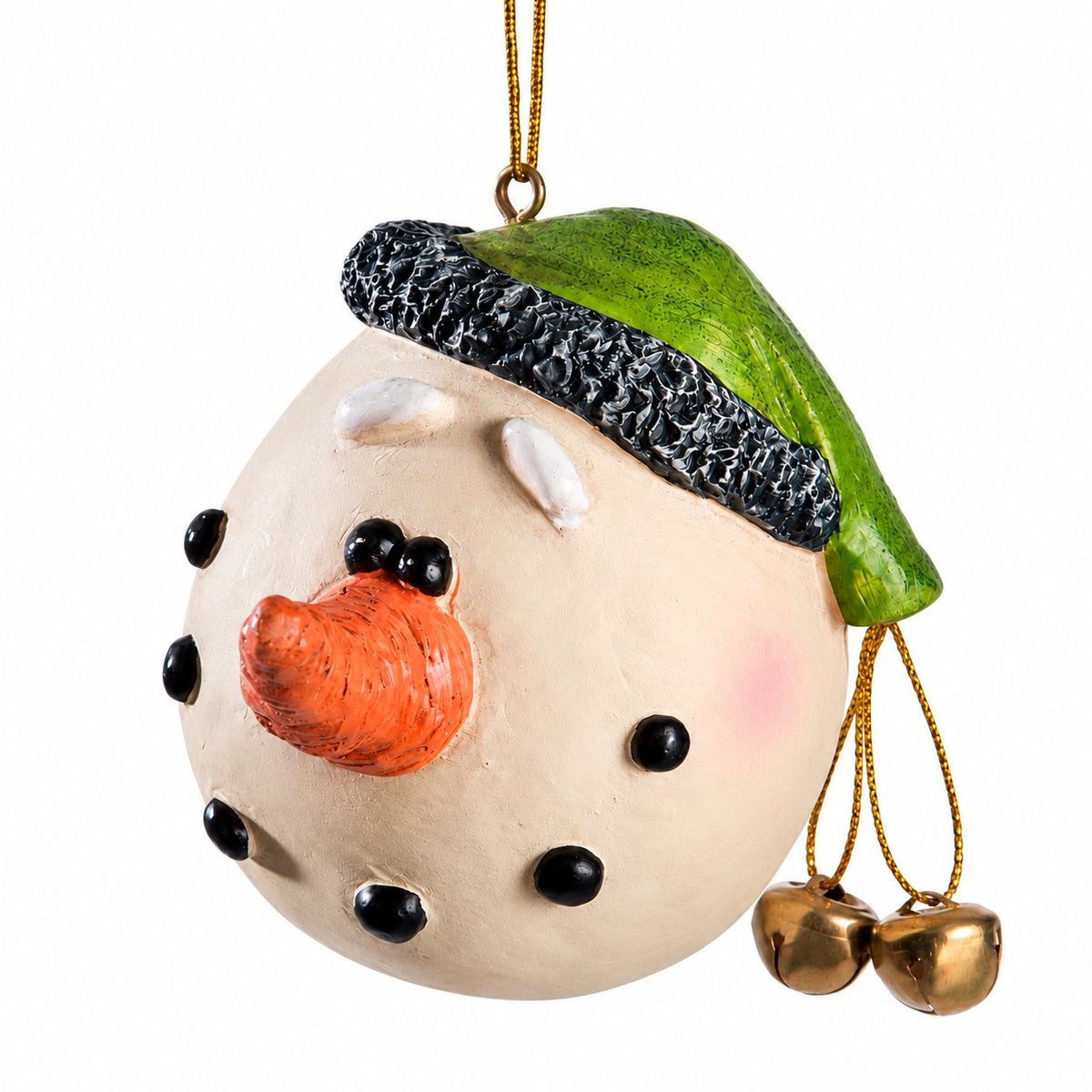 A ceramic snowman ornament with a cream-colored face, black dot eyes and cheeks, an orange carrot nose, a green hat with a black textured trim, and two small gold bells hanging from a gold string.