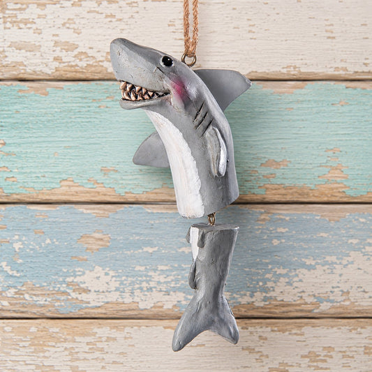 A shark hanging ornament with a jointed tail and jute hanger.  Designed by artist Bert Anderson