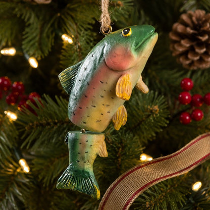 Hand painted hanging trout ornament on a Christmas tree.