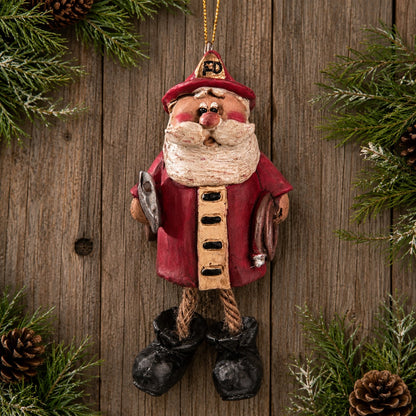 Firefighter Santa Claus Ornament with his axe , fire hose and dangly boots.  