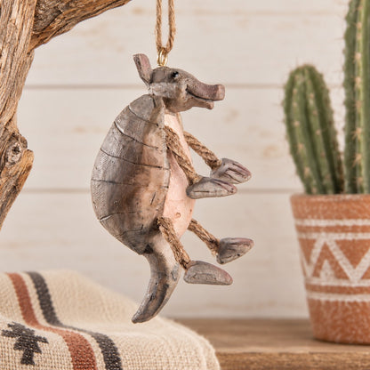 Armadillo Christmas Ornament by Bert Anderson  shown with cactus  and  other southwest decor.