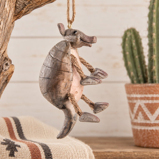 Armadillo Christmas Ornament by Bert Anderson  shown with cactus  and  other southwest decor.