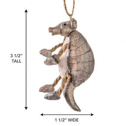 A hanging armadillo ornament shown on a white background with dimension arrows and text indicating 3 1/2 inches tall and 1 1/2 inches wide.