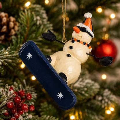 Bert Anderson Snowboarding Snowman Ornament hanging on a Christmas tree.