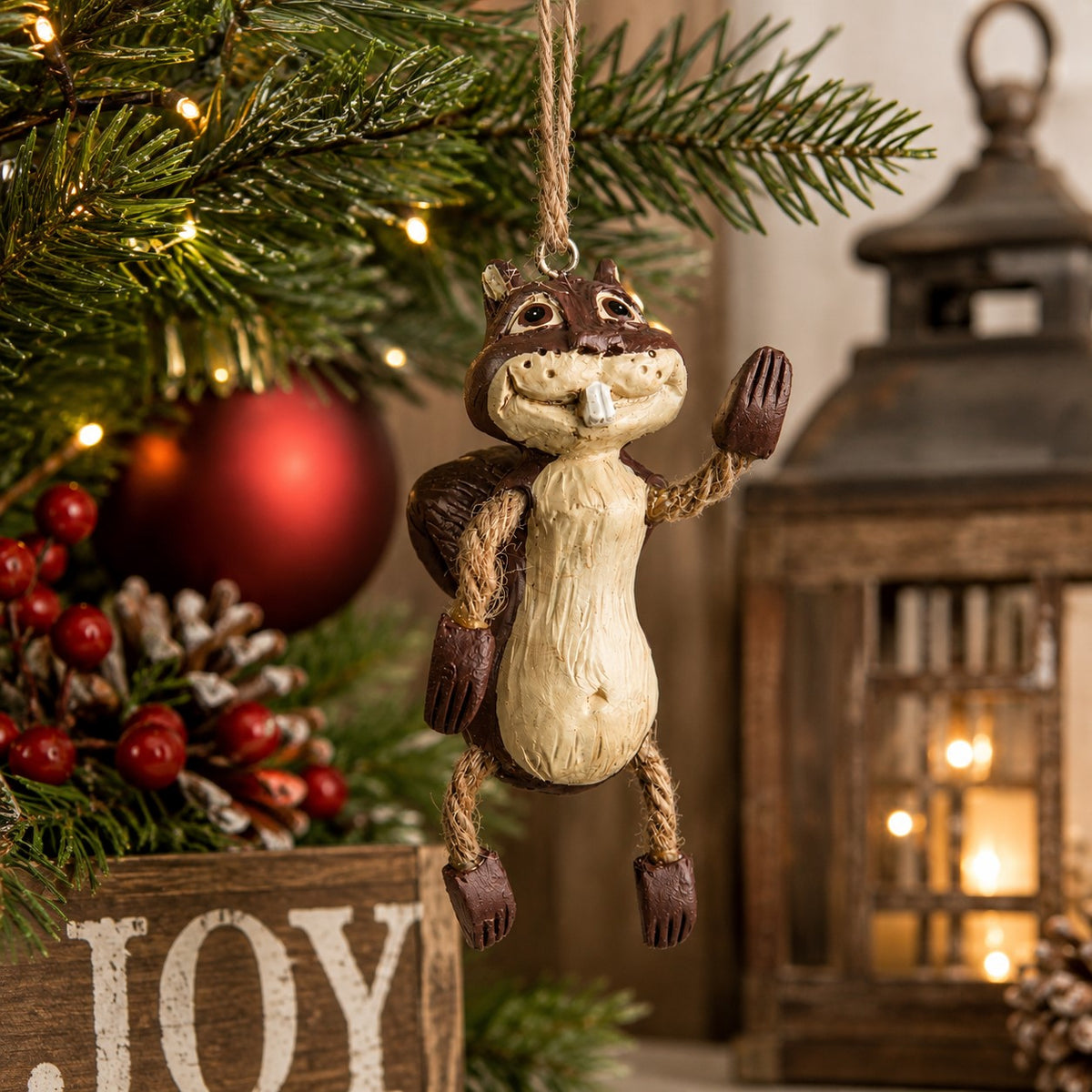 Whimsical squirrel ornamnet by Bert Anderson displayed on a Christmas tree.  