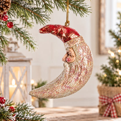 Bert Anderson crescent moon Santa ornament with shimmering finish displayed in light Christmas home décor with soft greenery and warm lights.