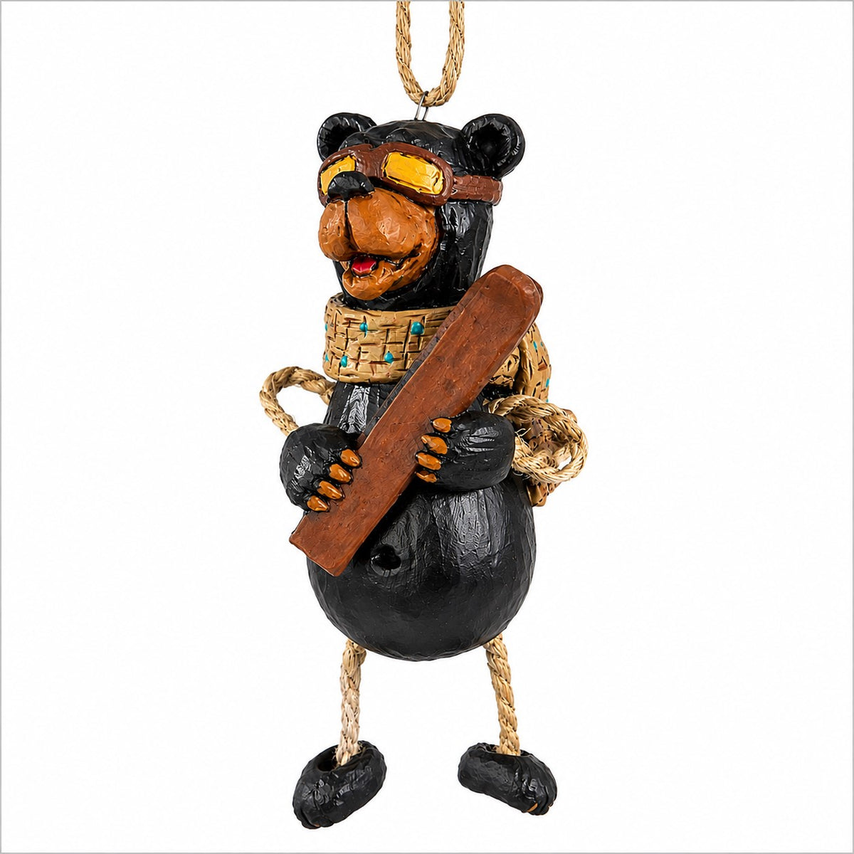 Skiing  bear ornament wearing ski googles and holding his skis on a white background.