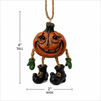 A Halloween hanging ornament shaped like a smiling orange pumpkin with a rope hanger, green mittens, and black boot-shaped feet. Measurement labels indicate 4 inches tall and 2 inches wide on a white background.