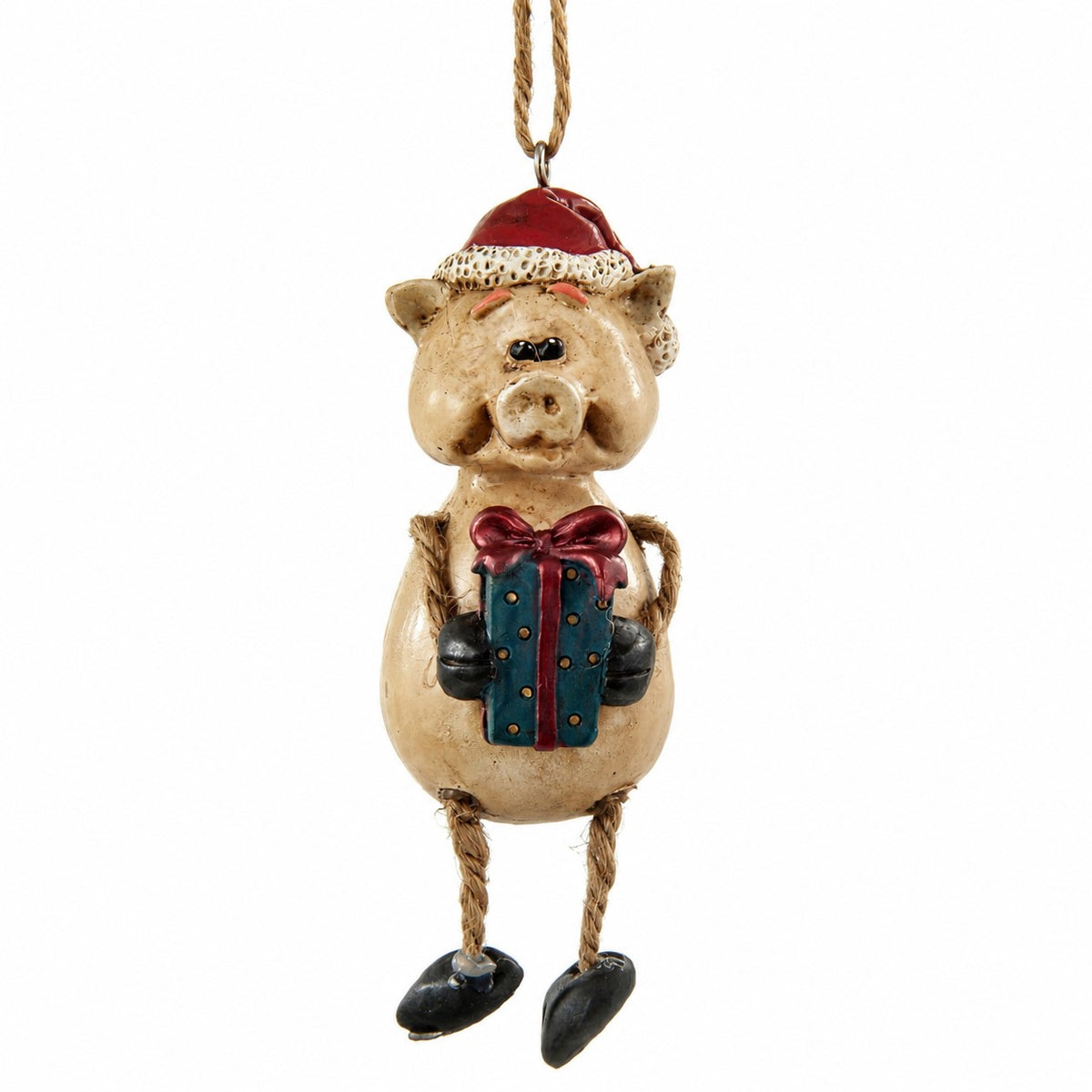 Decorative pig ornament with a red hat, black hooves, and holding a gift on a white background
