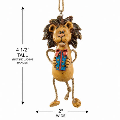 A hanging lion ornament holding a Christmas present shown on a white background with dimension arrows indicating 4 1/2 inches tall and 2 inches wide.
