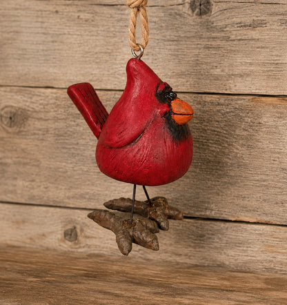 A Bert Andrson red cardinal Christmas ornament with wire legs and  hand painted detail.  
