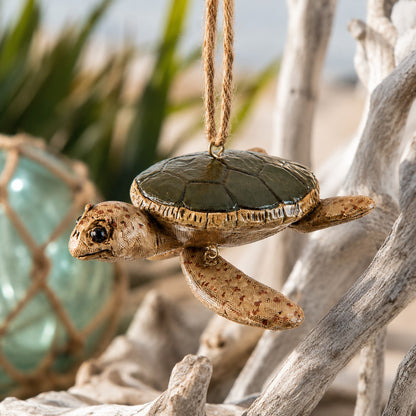 Sea Turtle hanging ornament with a coastal background.
