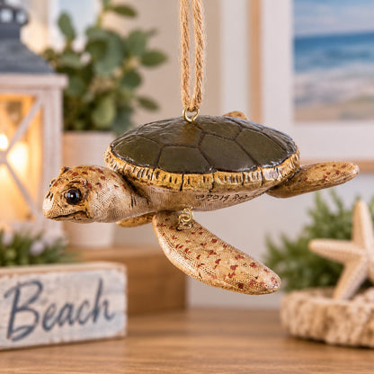 Bert Anderson sea turtle ornament with lifelike flippers hanging in bright coastal home décor with beach-inspired accents.