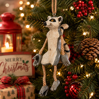 Whimsical hanging Ring-Tailed Lemur Ornament  displayed on festive Christmas holiday background.
