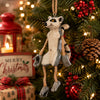 Whimsical hanging Ring-Tailed Lemur Ornament  displayed on festive Christmas holiday background.
