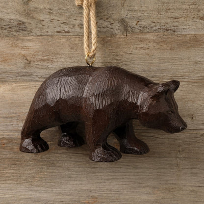 Bert Anderson Hanging bear ornament shown on a rustic board wall.