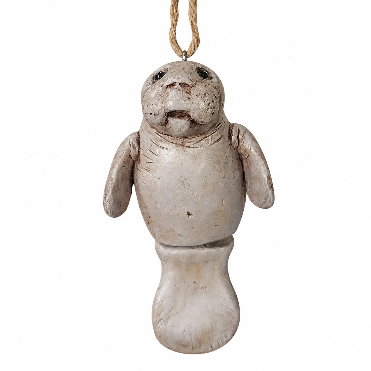 Resin manatee hanging ornament part of the Bert Anderson coastal collection a white background.