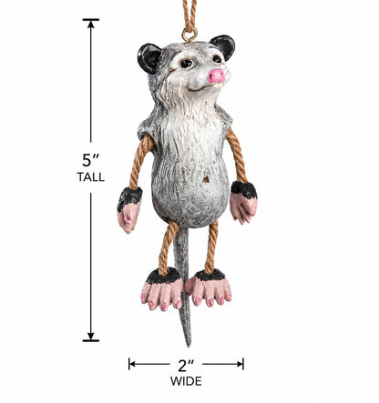 Opossum hanging ornament shown with measurments 5" tall x 2" wide.