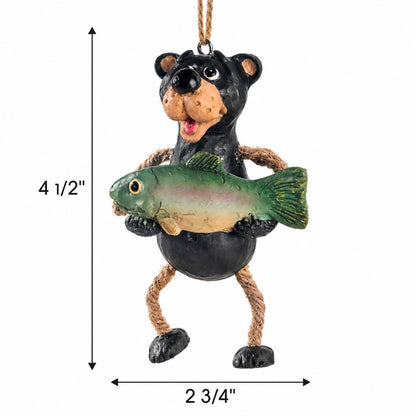 Bert Anderson black bear fishing ornament holding a fish with measurement arrows showing 4½" tall and 2¾" wide on a white background.