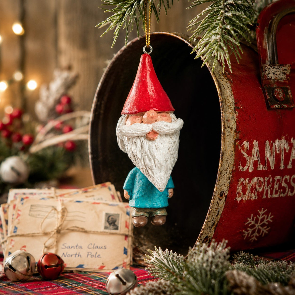 Bert Anderson gnome ornament with red pointed hat, white beard and blue coat displayed in a nostalgic Christmas setting with greenery and vintage holiday décor.