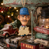 Bert Anderson train conductor ornament displayed in a nostalgic Christmas train setting with miniature locomotive, holiday greenery and vintage décor.