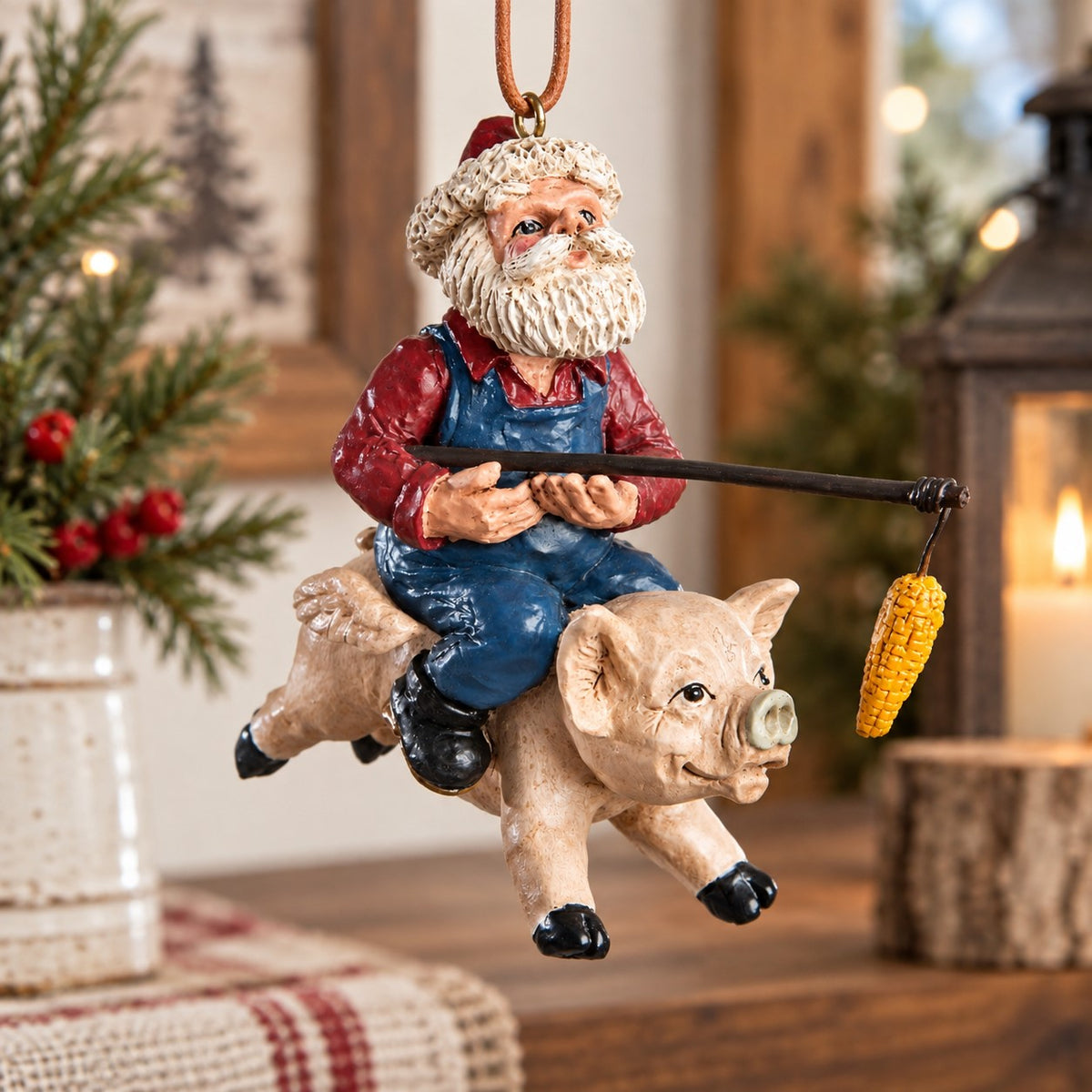 “Santa riding a flying pig ornament with dangling ear of corn hanging among Christmas tree branches and warm lights.”