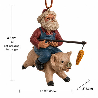 “Santa riding a flying pig ornament on a white background showing 4½-inch tall, 4½-inch wide and 2-inch long measurements.”