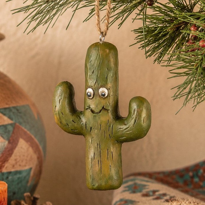 Bert Anderson cactus ornament hanging in a Southwestern décor setting with desert pottery, cactus accents and evergreen.
