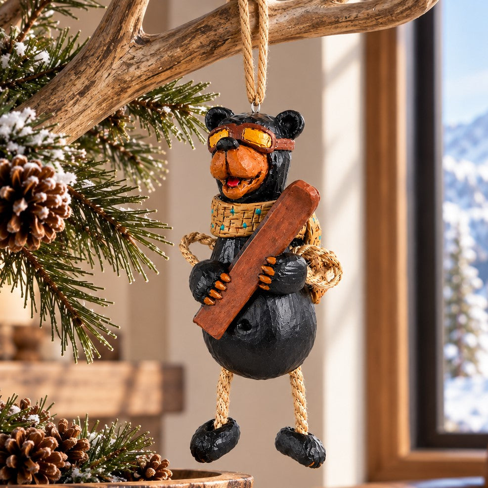 Bert Anderson skiing bear ornament with goggles and skis displayed in a bright mountain lodge with rustic wood accents and snowy mountain views.
