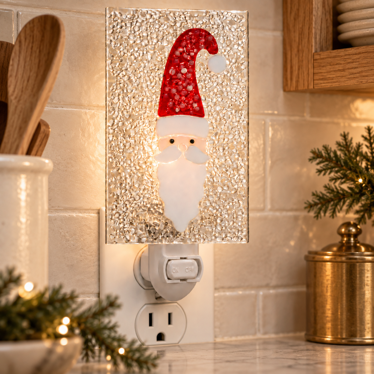 Santa fused glass Christmas night light glowing in a holiday kitchen