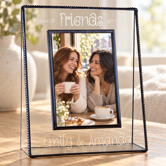 Personalized Friends clear glass picture frame, 4x6 vertical, engraved Emily & Amanda with a photo of two friends at a cafe.
