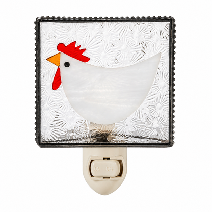 Farmhouse plug-in chicken night light glowing on rustic wall