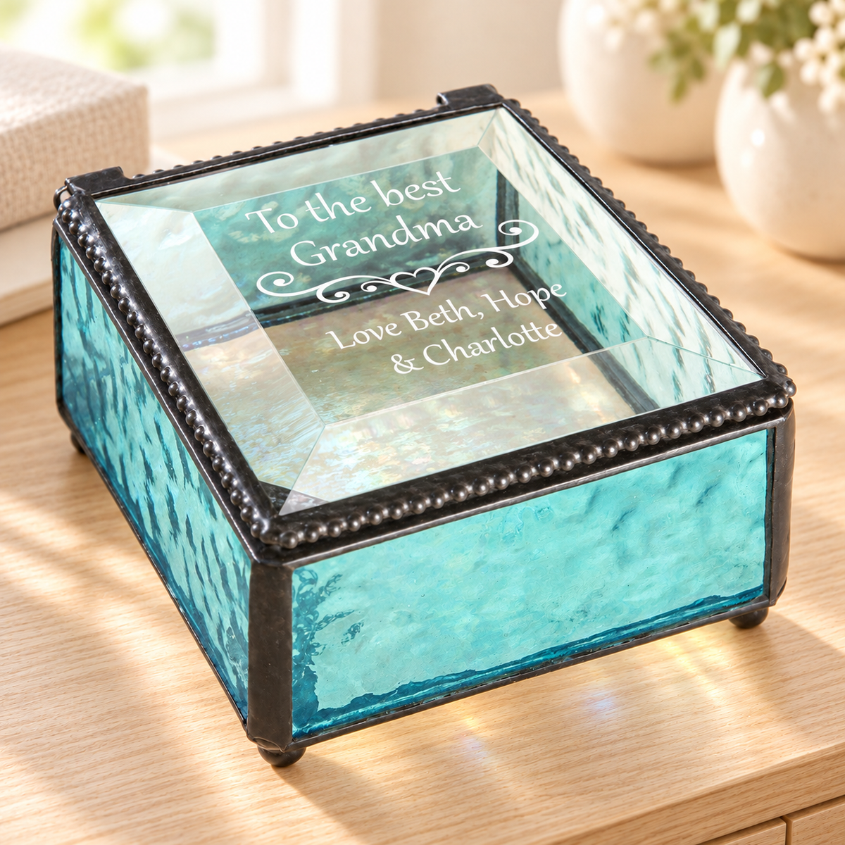 J Devlin Windsor Blue pale turquoise glass Grandma keepsake box with a clear beveled lid, heart scrollwork, and “To the best Grandma, Love Beth, Hope & Charlotte” engraving.