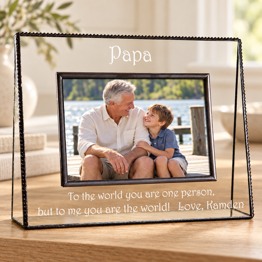 J Devlin 4 × 6 horizontal clear glass Papa frame showing a grandfather and grandson, engraved “To the world you are one person, but to me you are the world! Love, Kamden.”